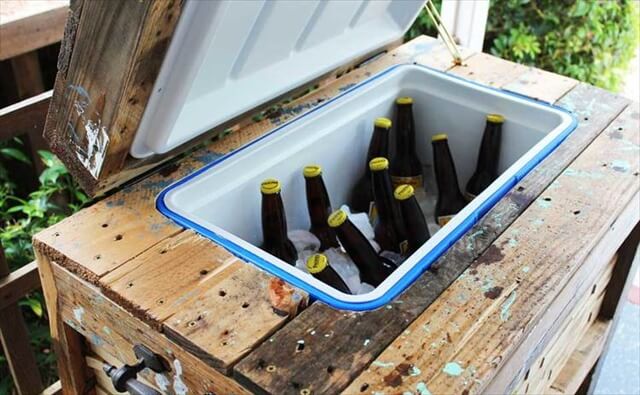 Rustic cooler box filled with ice cold beer