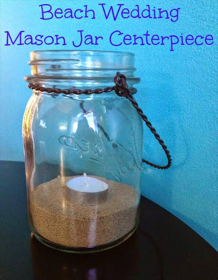 Centres Mason Jar de mariage à la plage